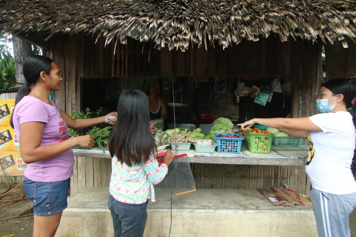 Buying fresh foods at a local market