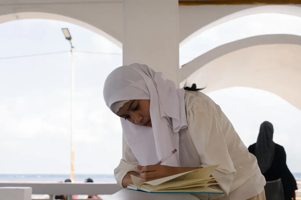 Rai, 15 writes her dreams and aspirations for Bangsamoro Leaders in a notebook. 