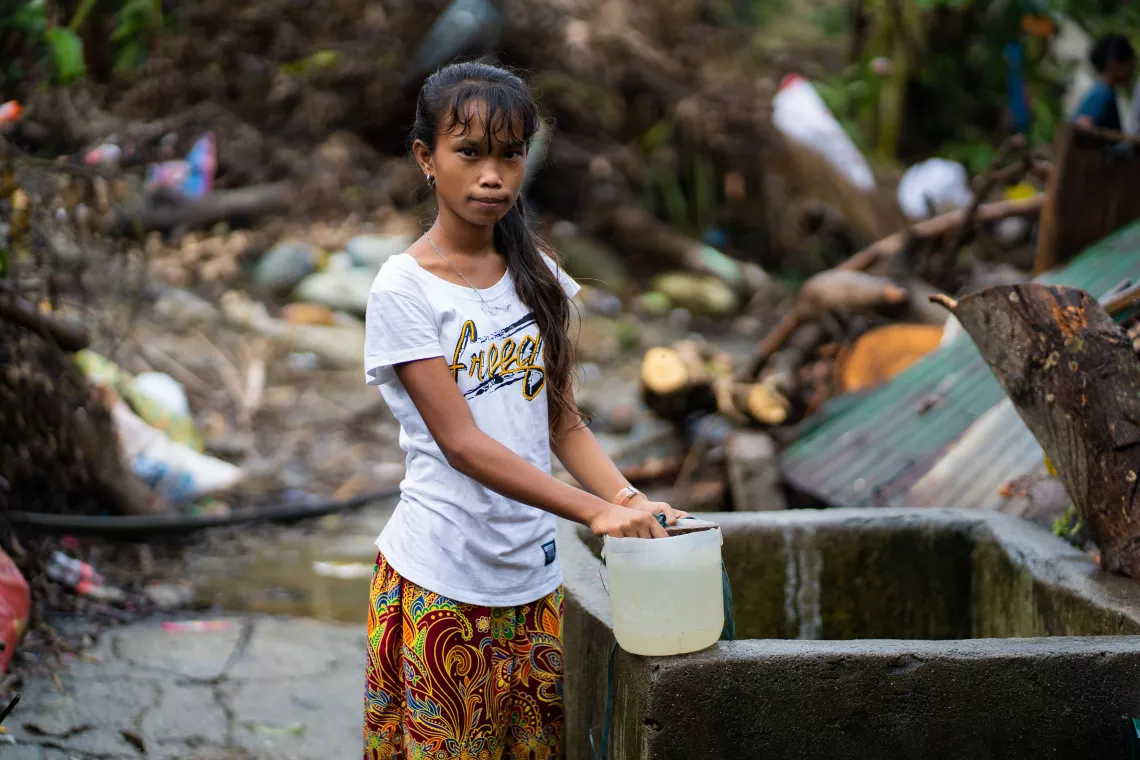 A child fetching water from a well
