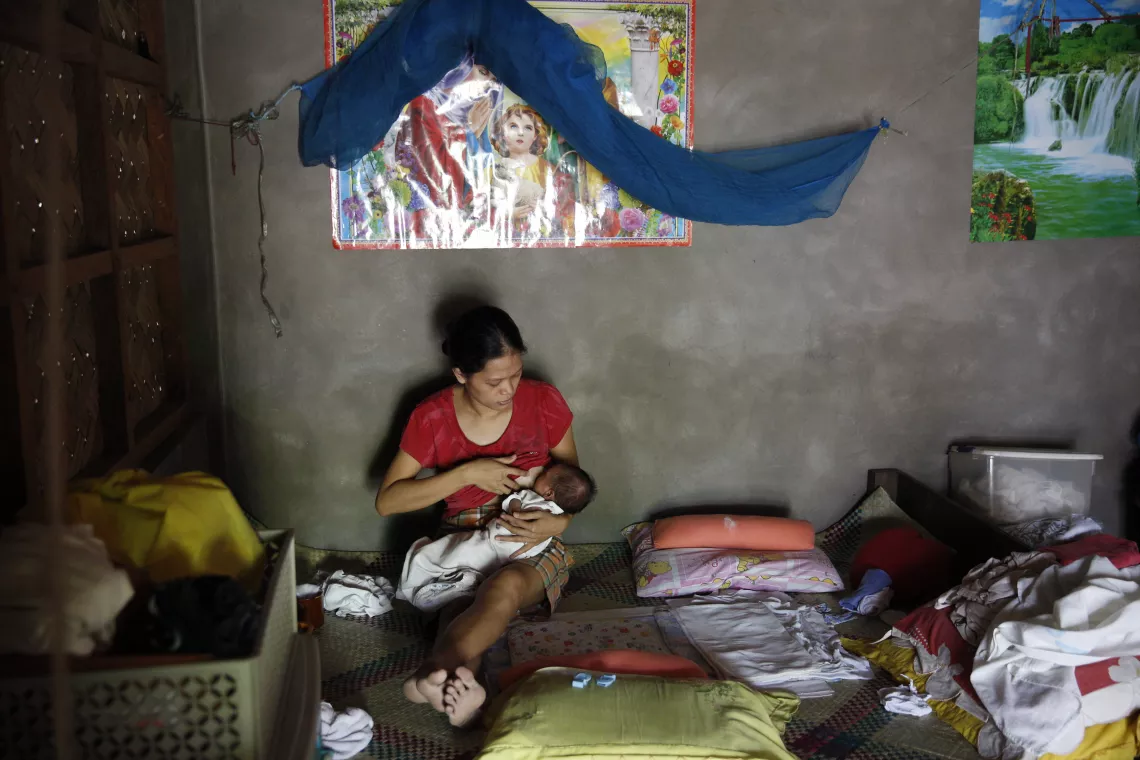 Mother breastfeeding her child