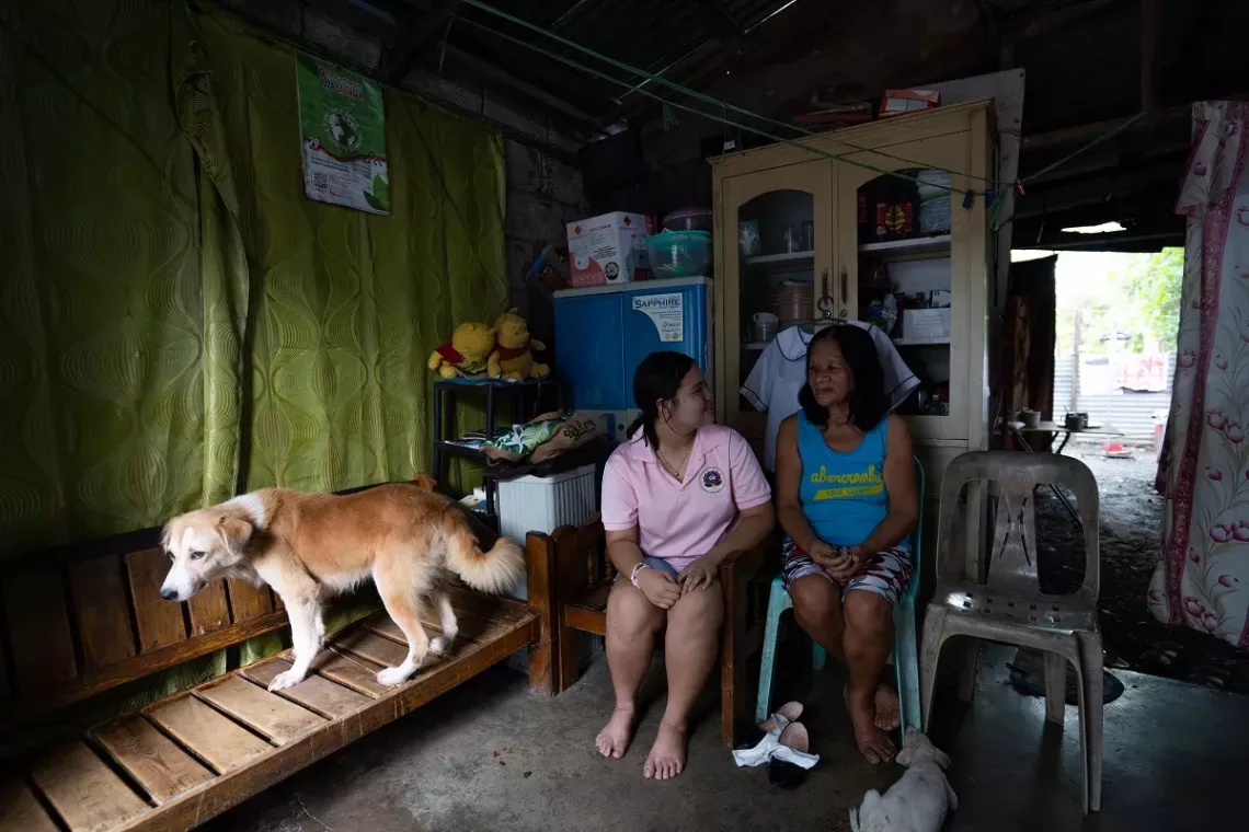 Shaine (left) and her grandmother Amelia (right). Lola Amelia has been taking care of her grandchildren.