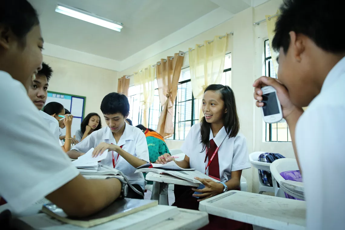 Students participate in a group activity inside their classroom