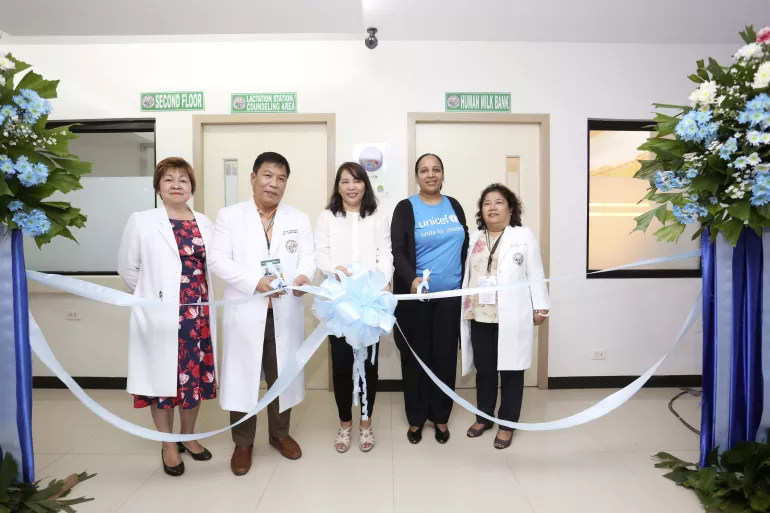 Officials of the Department of Health, Eastern Visayas Regional Medical Center and UNICEF cut the ribbon in front of the EVRMC Human Milk Bank