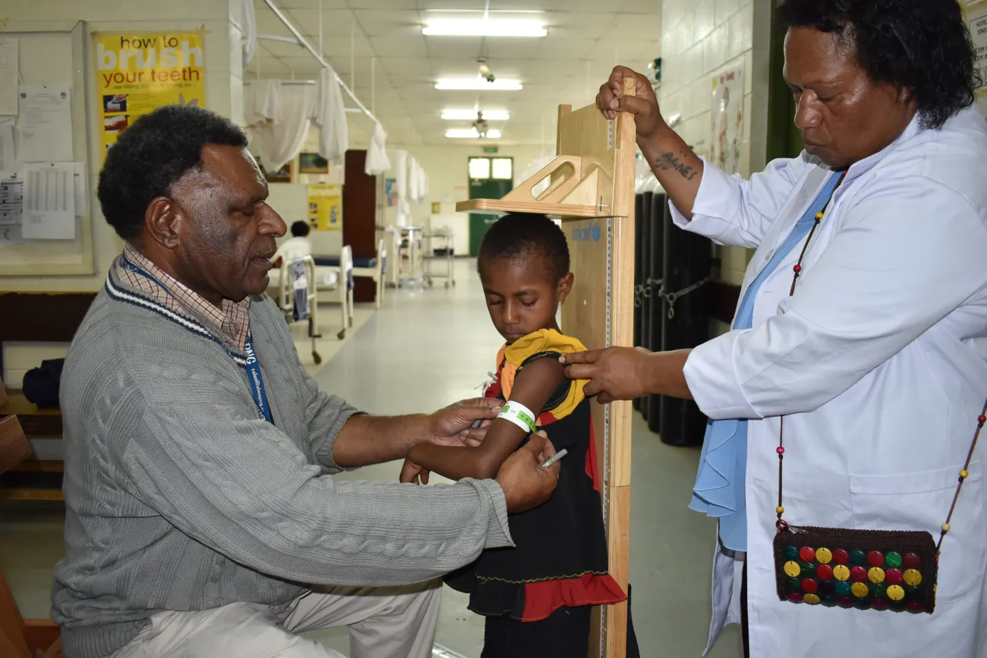 A young child on a nutrition programme and recovering from severe acute malnutrition shows good progress at her review.