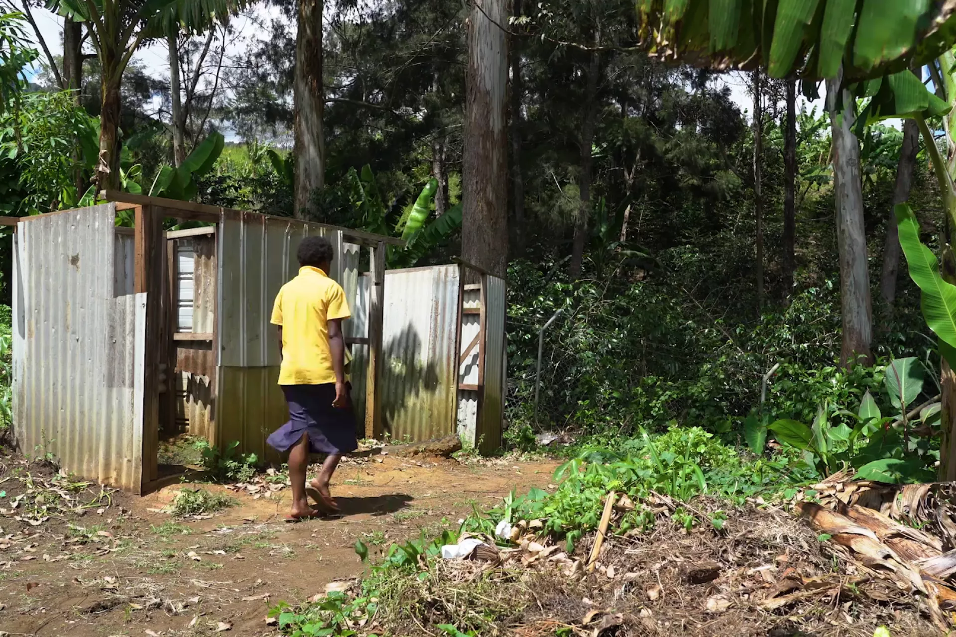 A student going to use one for the old school&rsquo;s toilets which used to be shared by both female and male students. 