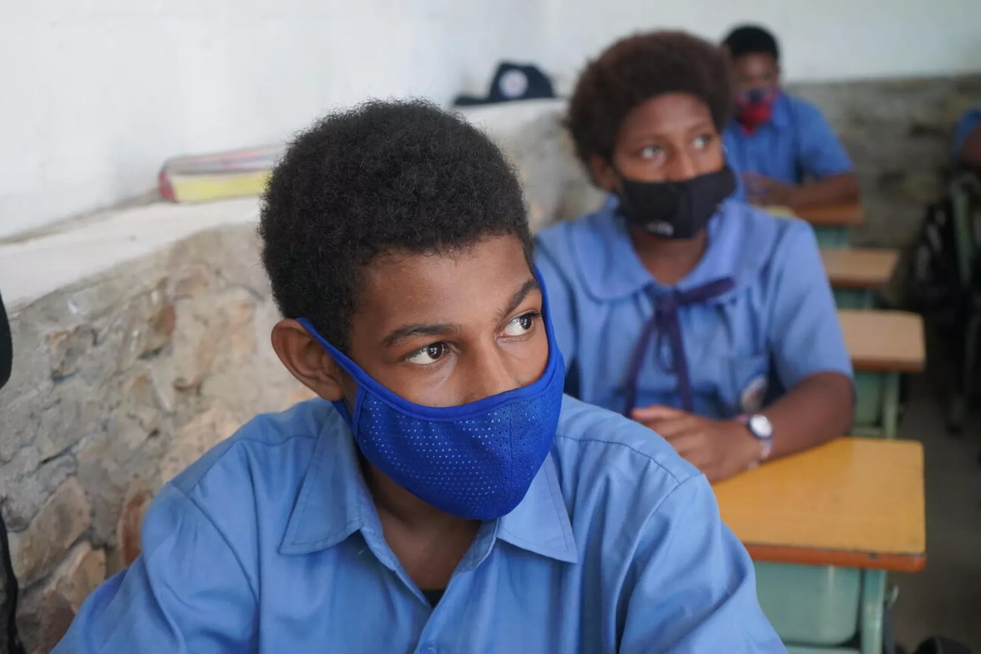Mask wearing in class is a new normal for students in Papua New Guinea as they continue to learn through the COVID-19 pandemic.