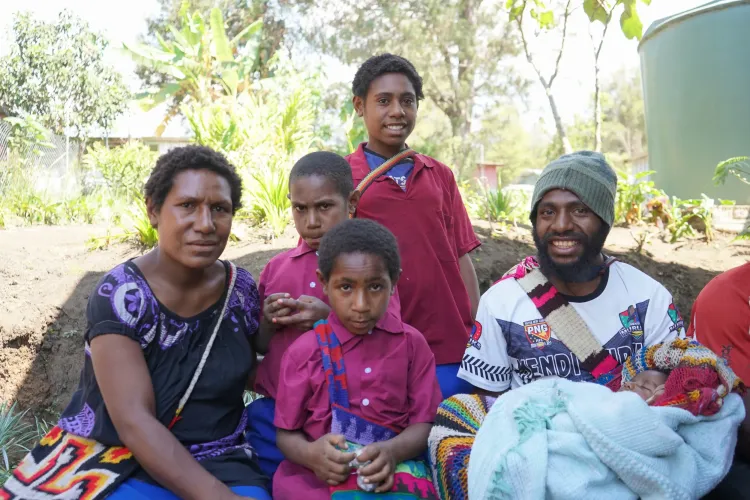 Scholar Bernard with her brother-in-law and her children