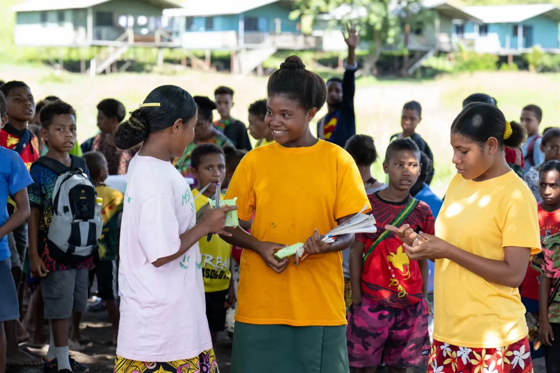 Lorna chats with her friends and classmates during recess.