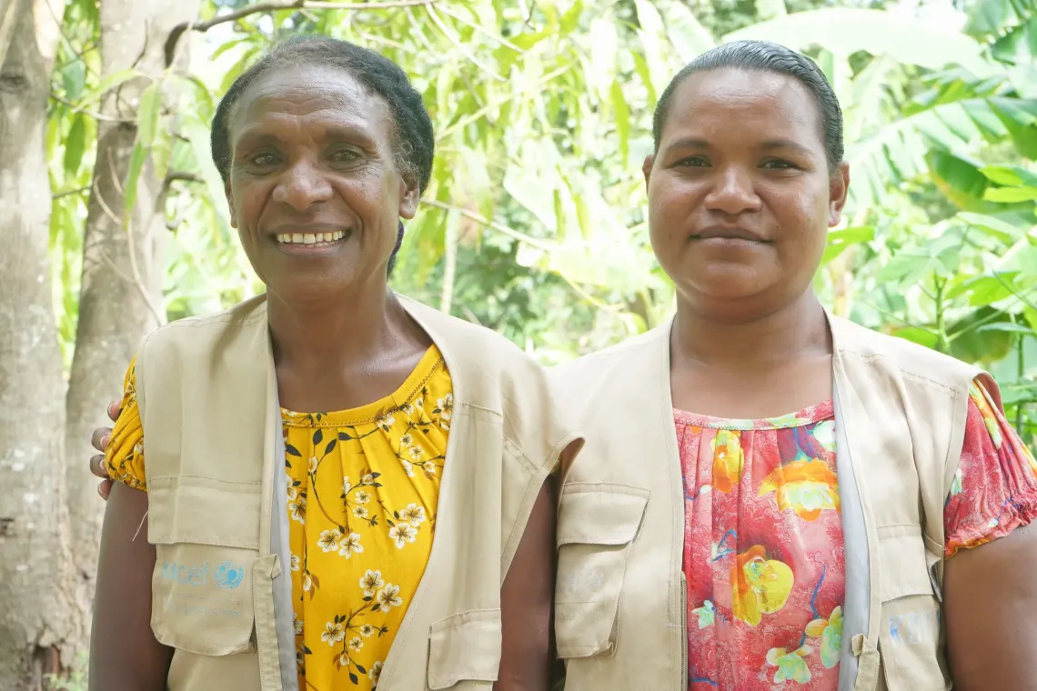 Joan (left) and Kila (right) are committed VHA's trained by UNICEF to help implement the Community Nutrition Action programme in Kemabolo, Rigo District.