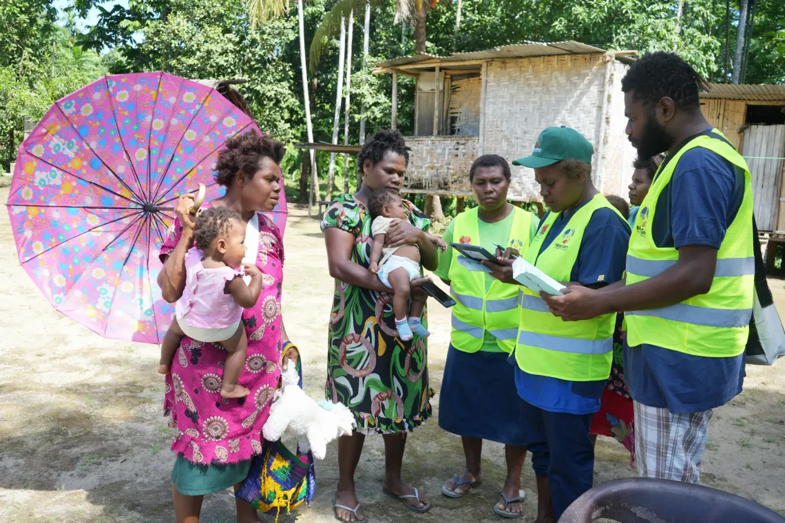 VHAs talk to mothers at Maruga community.