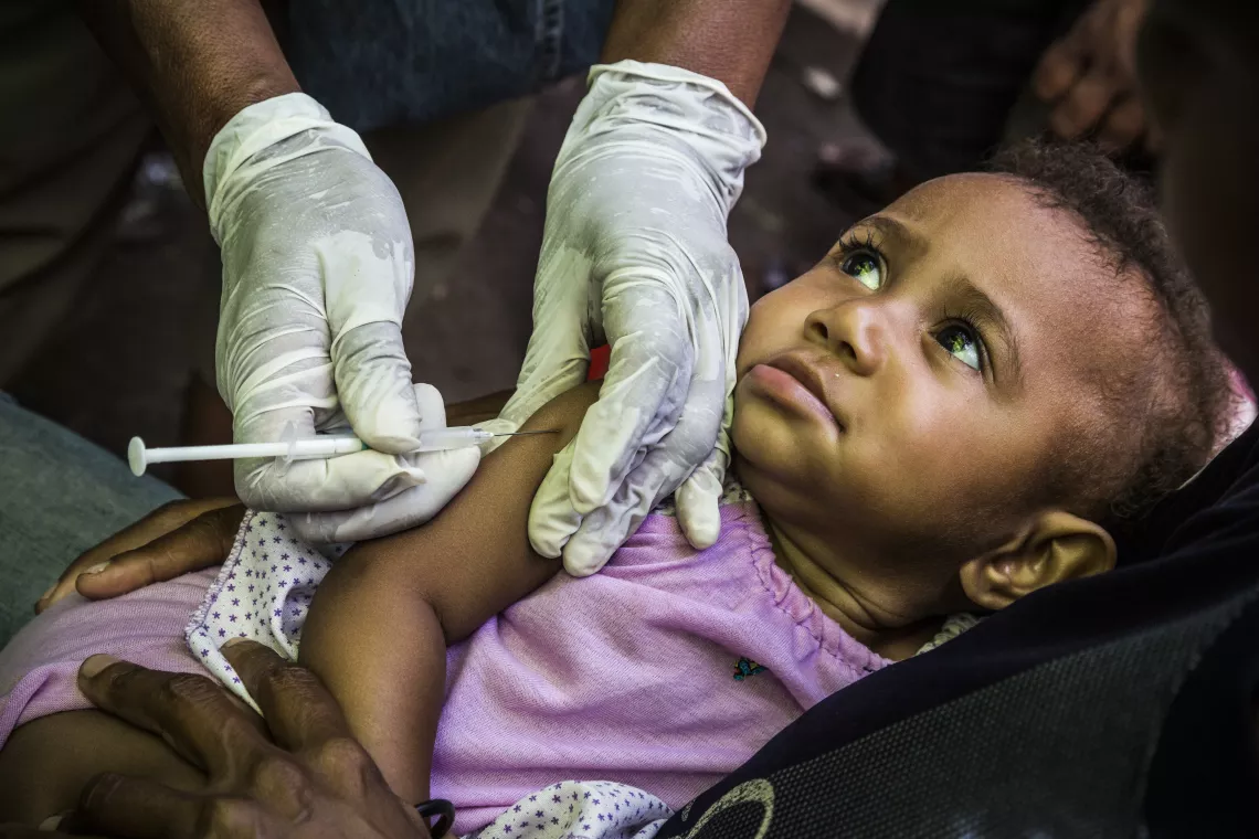 A child given immunization vaccine.