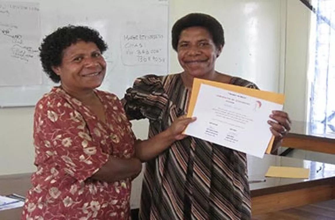 Margaret receives her certificate at the end of the Mother Mentor training.