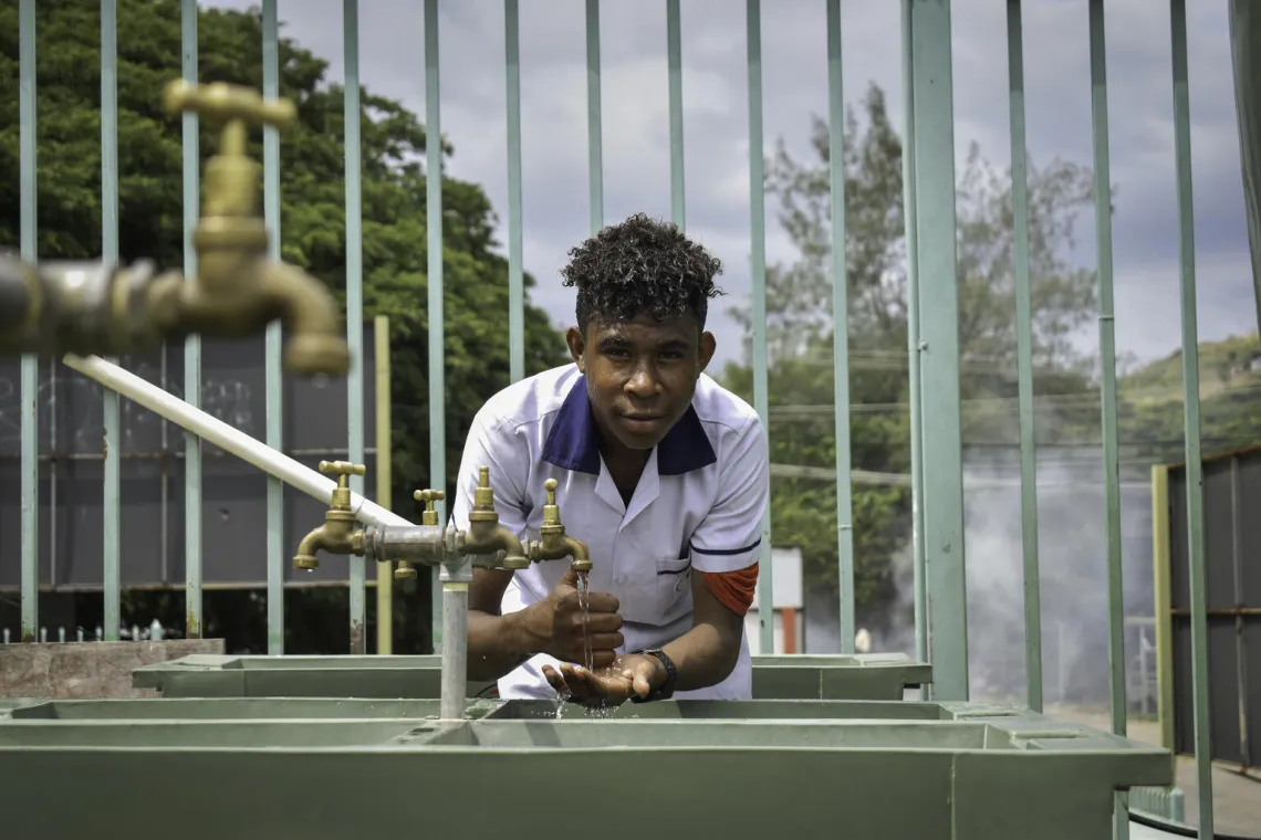 A student from Sevese Morea Primary School using the new WASH facilities.