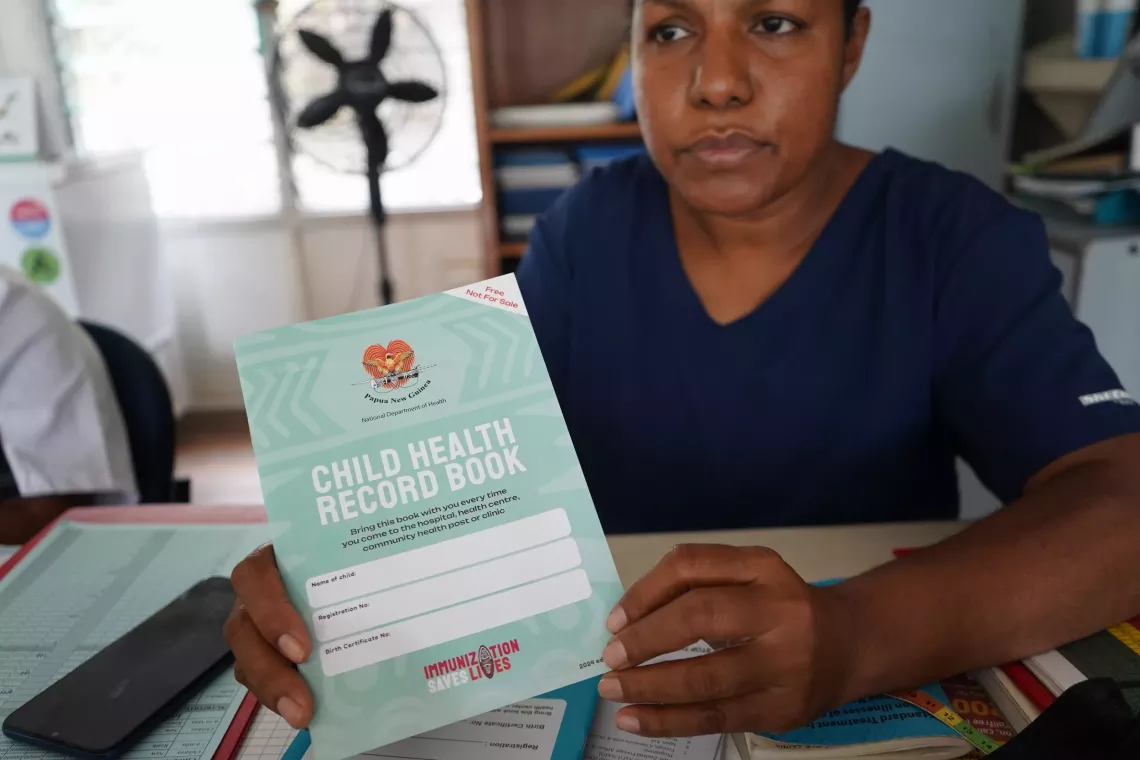 Sr. Baker explains the importance of the child health record book.