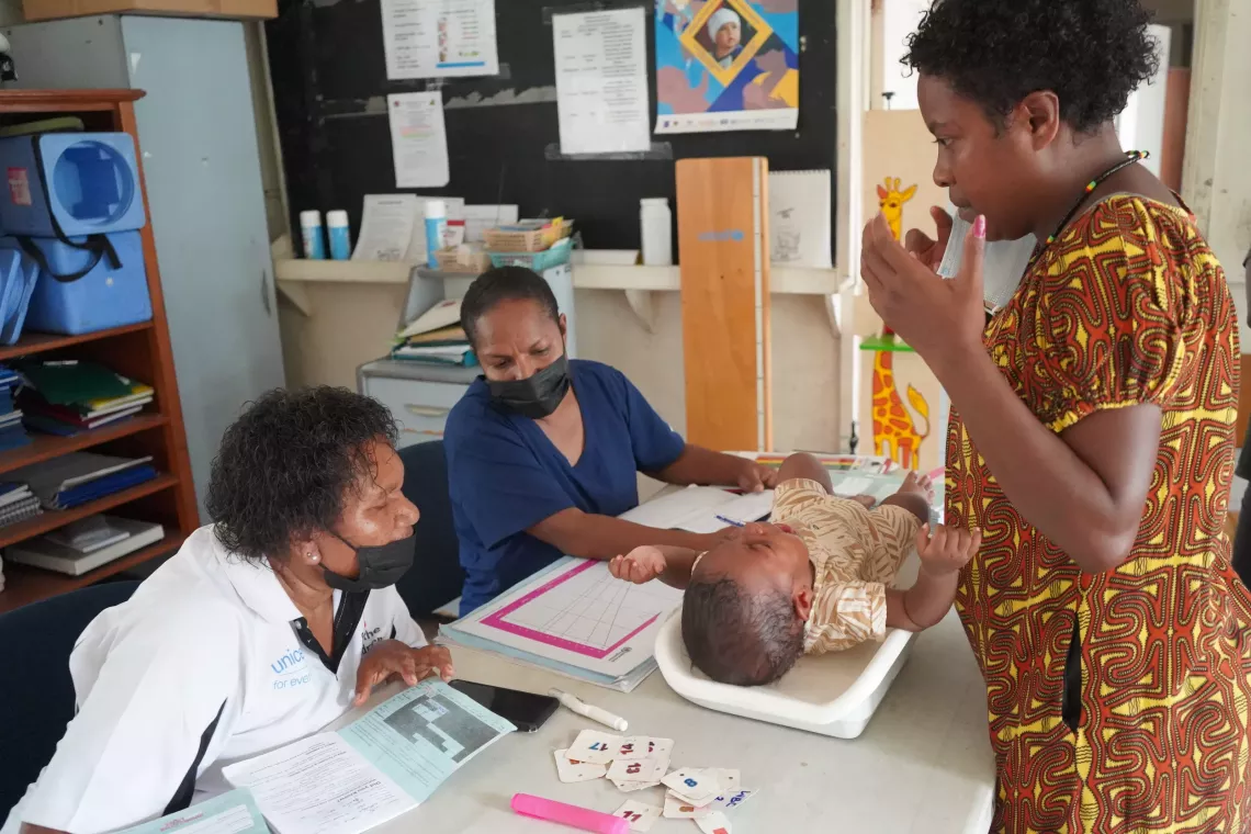 Mother of one, Narelle has brought Gabriel, her 5-month old son for catch up immunisation at the 6 Mile Clinic. &nbsp;Health workers assess his health and growth before he receives his immunisation.