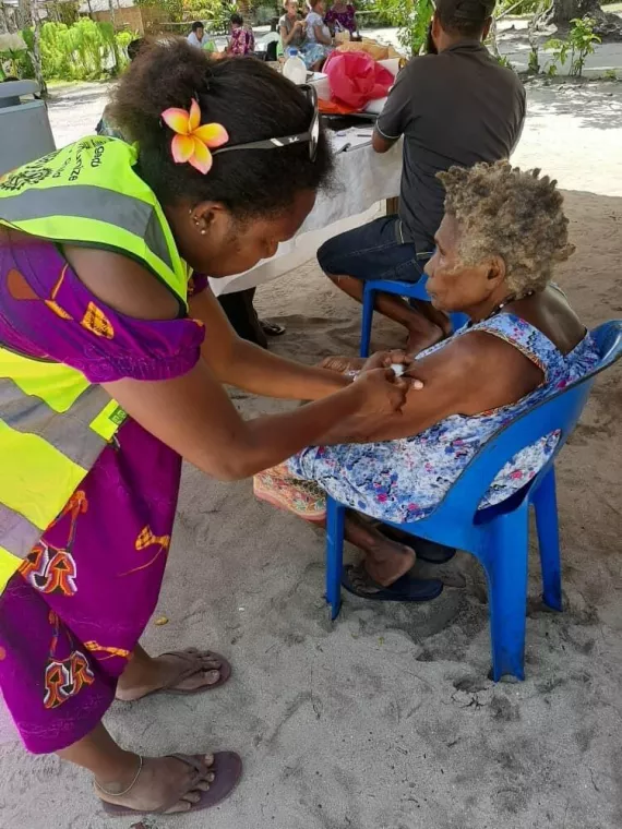 Elderly women in Fatmilak receiving their J&J vaccine, New Ireland Province