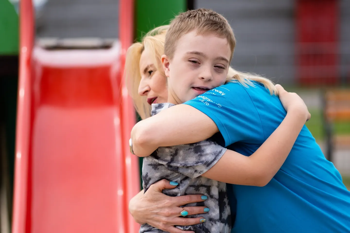 Child hugging a woman.