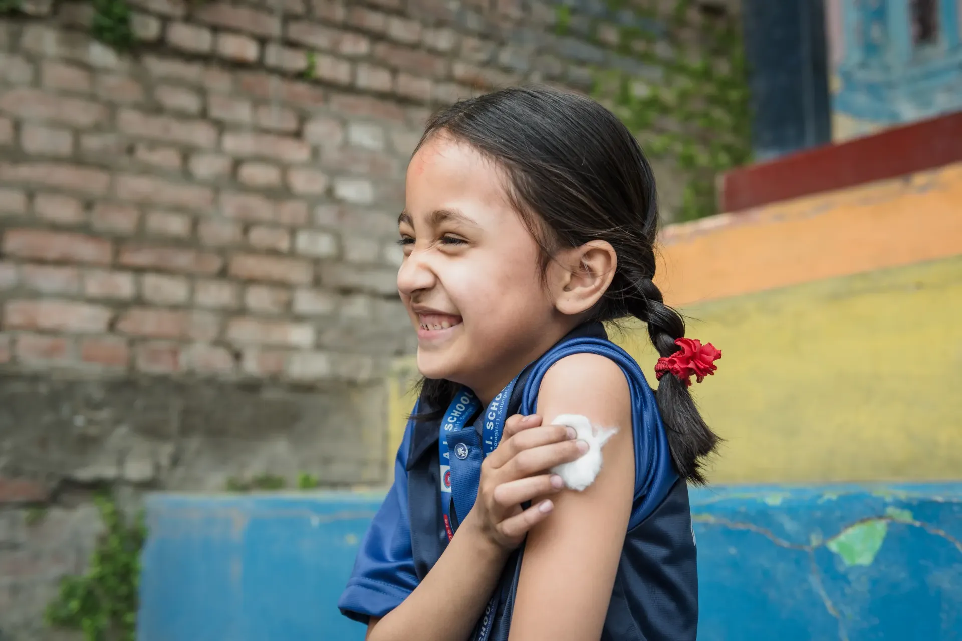 Young girl photographed after getting a vaccine. 
