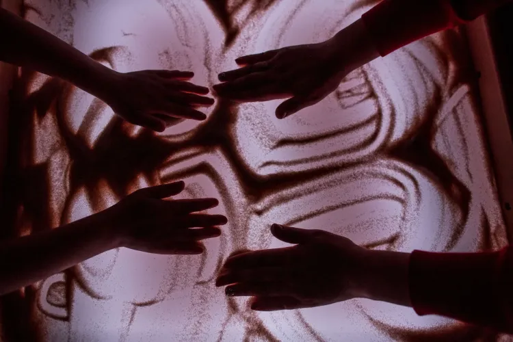 Image of hands taken during sand therapy.