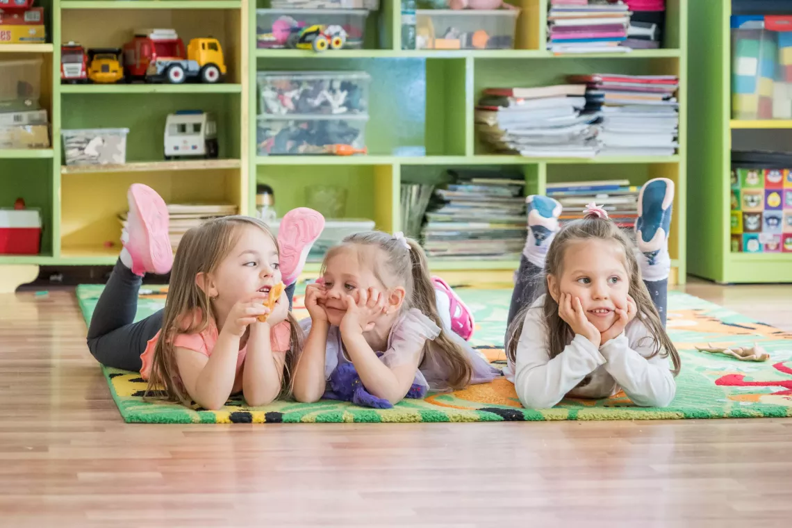 Children lying on their bellies 