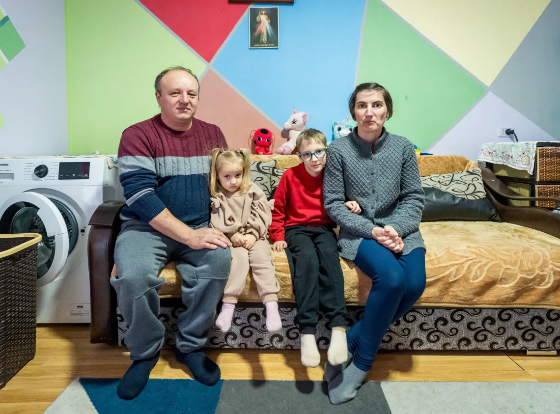A boy and his family inside their house