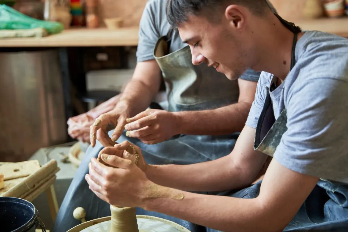 Young boy doing pottery. 