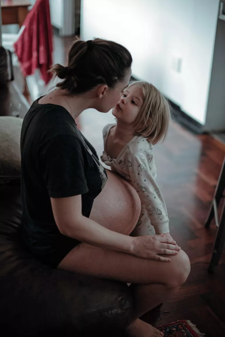 On 1 April 2020, (right) Ava, 4, shares a moment of intimacy with her mother Chloe sits with Ava, 4, at home in Johannesburg, South Africa