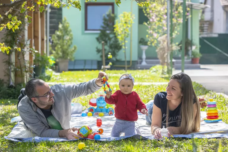 Mother Magdalena and father Nikola are plazing and taking care of their seven month old baby girl Helena.