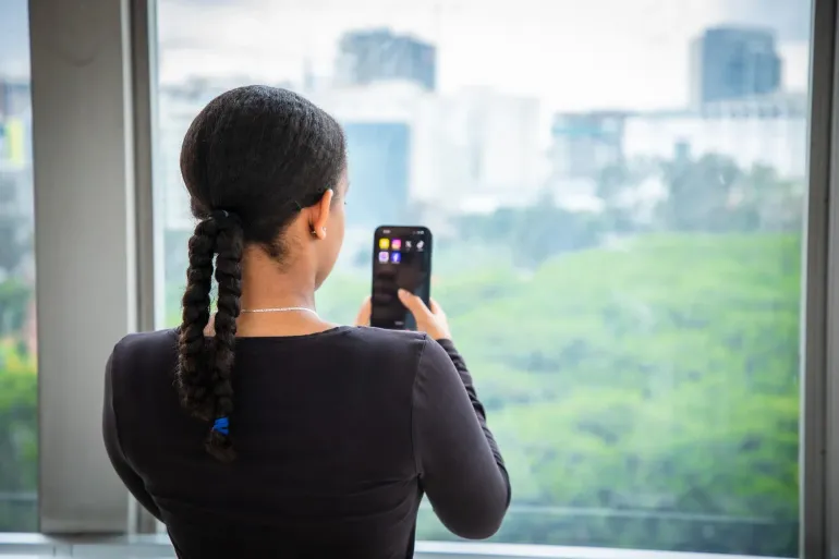 Girl looking into her mobile phone