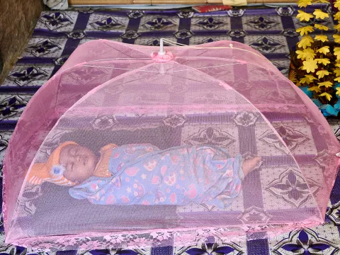 A young Rohingya refugee mother Setara, 20, keeps an eye on her baby, Yasin Arafat of 8 months
