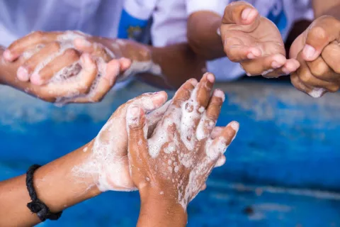 Students washing hands