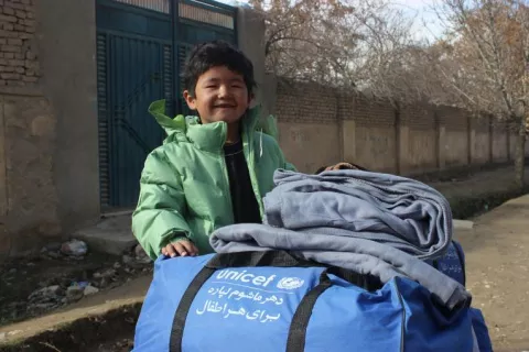 Young boy with UNICEF supply