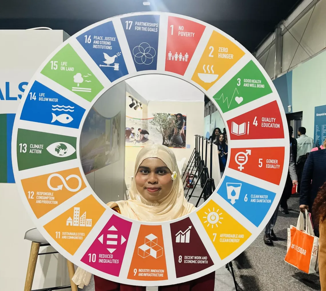 Image of Fathima, a young female COP29 delegate from Maldives 