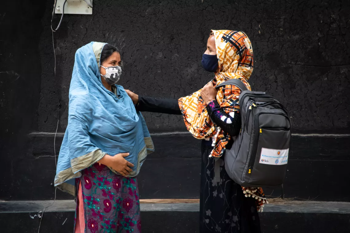 Shirin Akhter, a community volunteer of the Village Education Resource Center (VERC), is visiting Torima Akhter (26), who is five months pregnant with her first child, to inform her about necessary health services. 