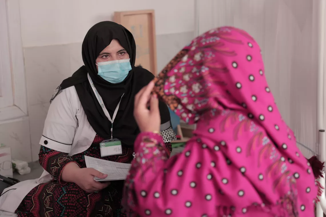 Midwife Gul Ghotai consults with Nazia, 30 yrs old, a pregnant woman