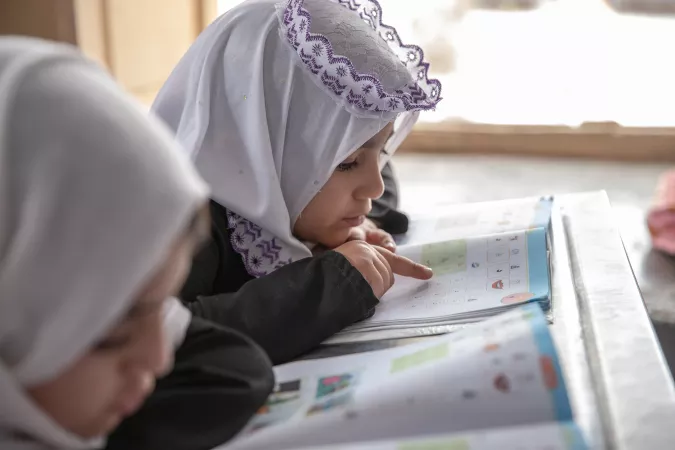 Primary school-aged girls in grades 1-3 attend classes at Tajrobavi High School in Herat, Afghanistan.