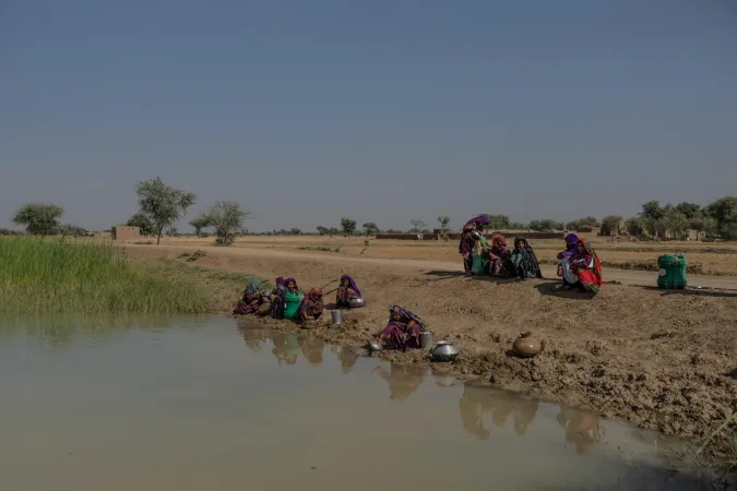 Women fetching contaminated water