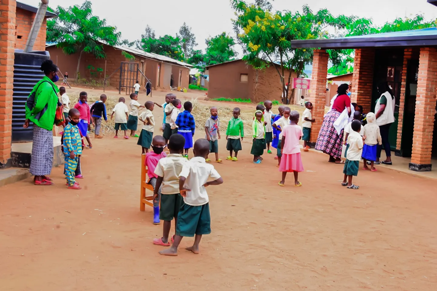 ECD students wait for their parents to pick them up from school on December 9.