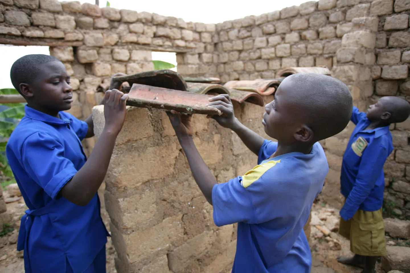 Two female students help build a community structure