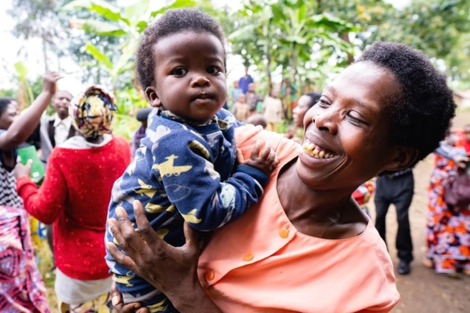 A woman holding a child
