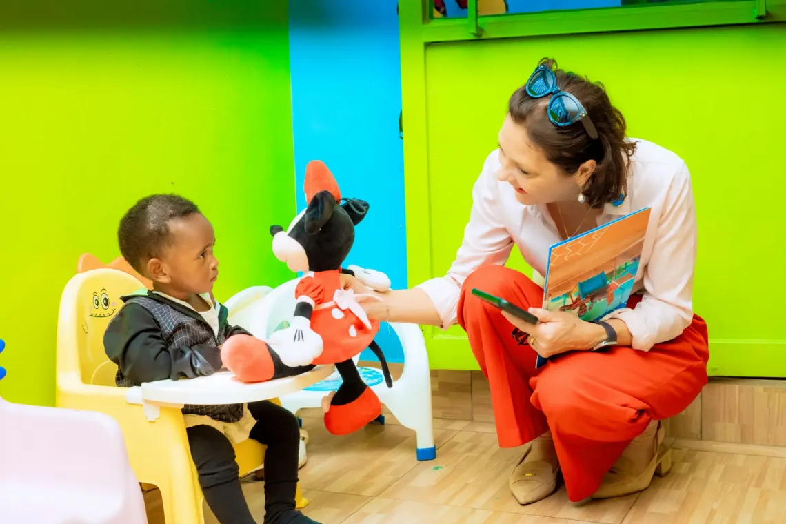 a woman talking to a child