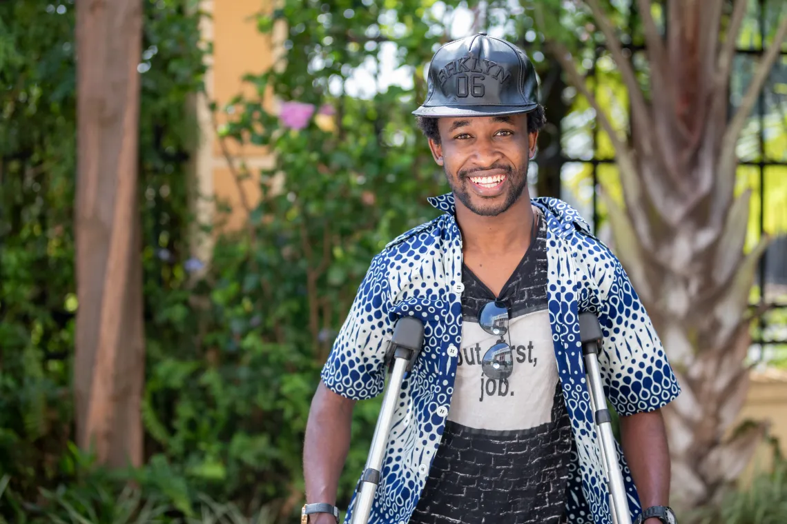 On the International Day of Persons with Disabilities, UNICEF held an Activate Talks event in Rwanda where speakers called for an end to stigma and discrimination. In this photo, Omar Mutabazi smiles proudly before discussing how he overcame struggles with paraplegia.