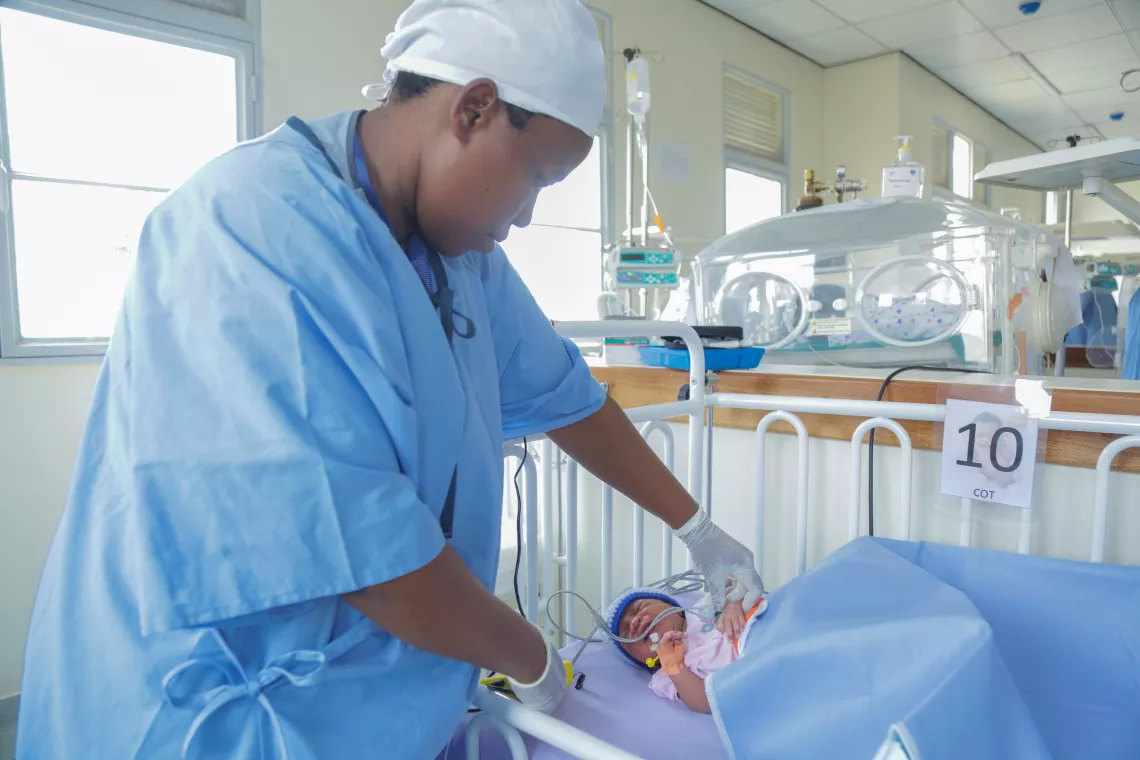 Head Paediatric Nurse Jacqueline Mukawiringiye tends to a prematurely born baby in the neonatal ward of Rwanda's Gahini Hospital.