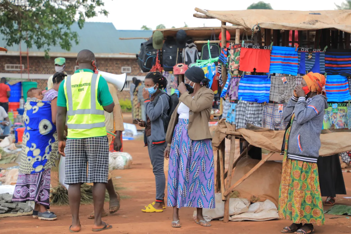 Youth volunteers in Kirehe District, Rwanda, help fight COVID-19 alongside UNICEF consultants in risk communication and community engagement, encouraging handwashing with soap and physical distancing.