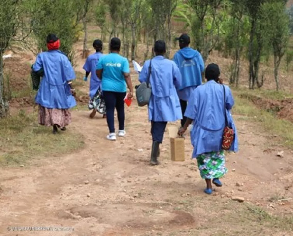In Nyamagabe District, Western Province, Rwanda UNICEF staff join Community Health Workers to distribute the second round of the poliovirus vaccine