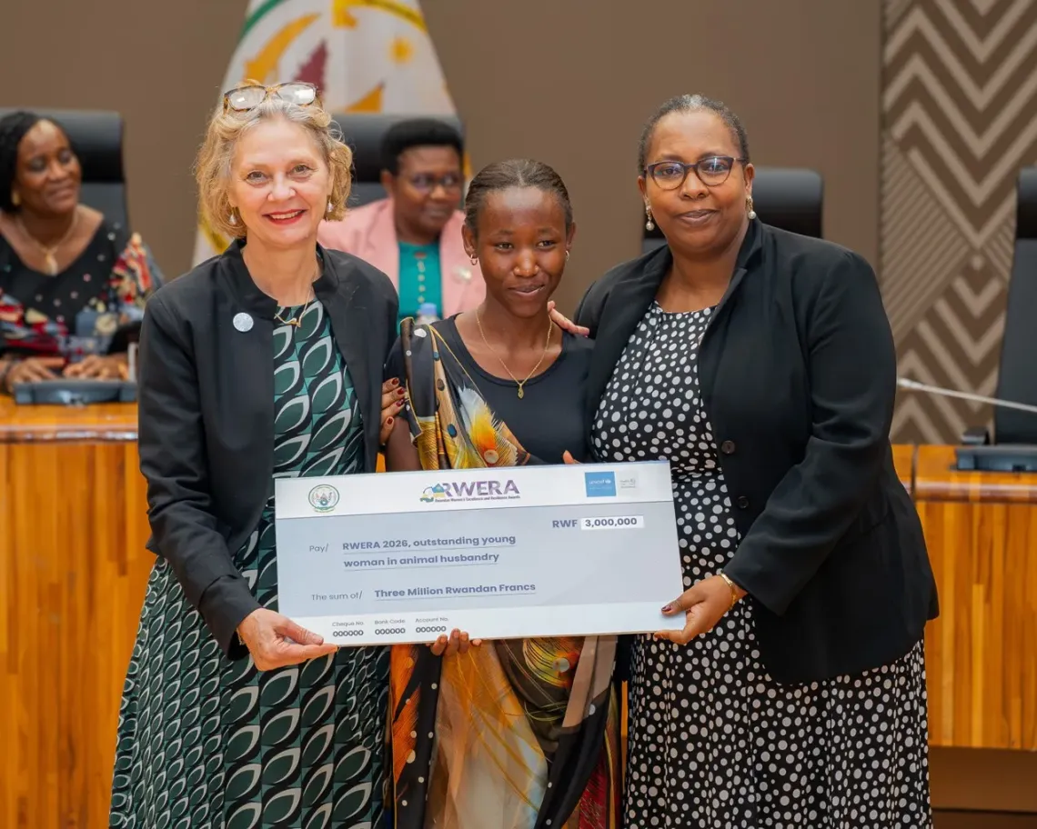 women handing a cheque
