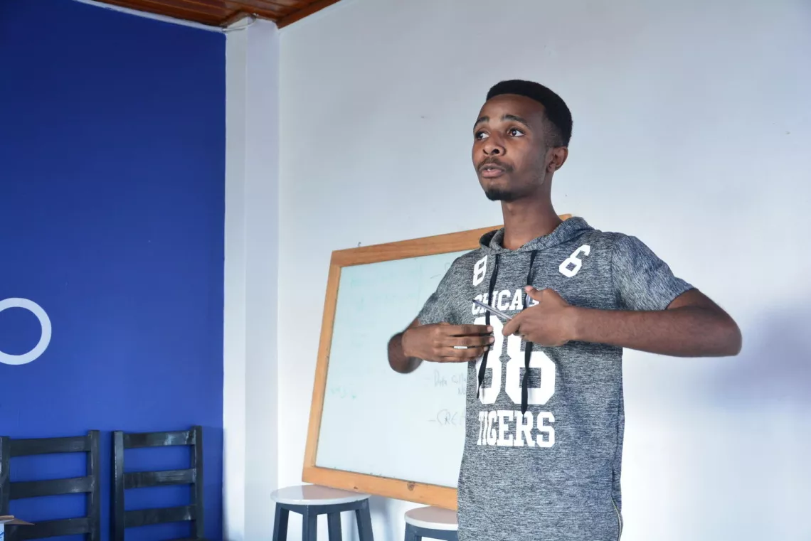 Young boy in Rwanda presents business idea