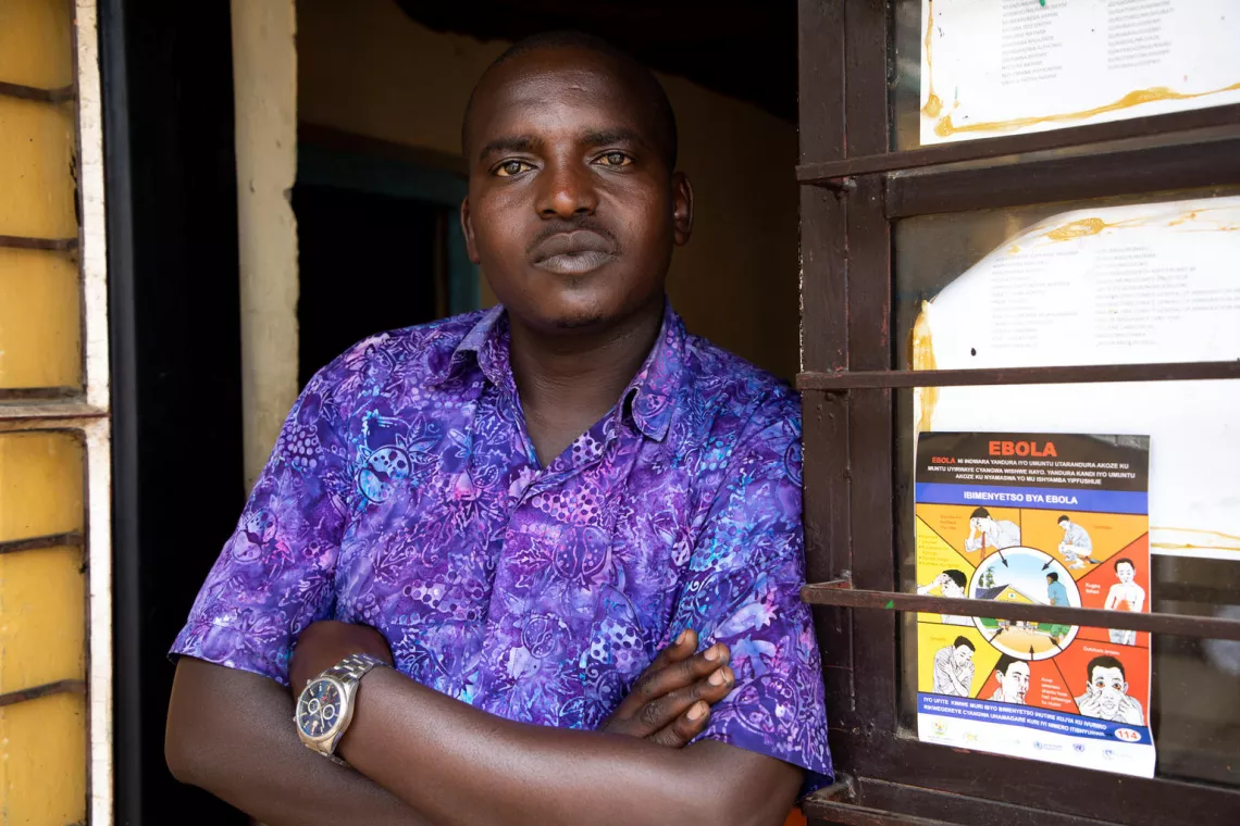 Francois &ldquo;Sano&rdquo; Niyigena stands ouside Radio Isano, using the influence of his popular station to broadcast Ebola prevention advice to market-goers on the Rubavu-Goma border. 