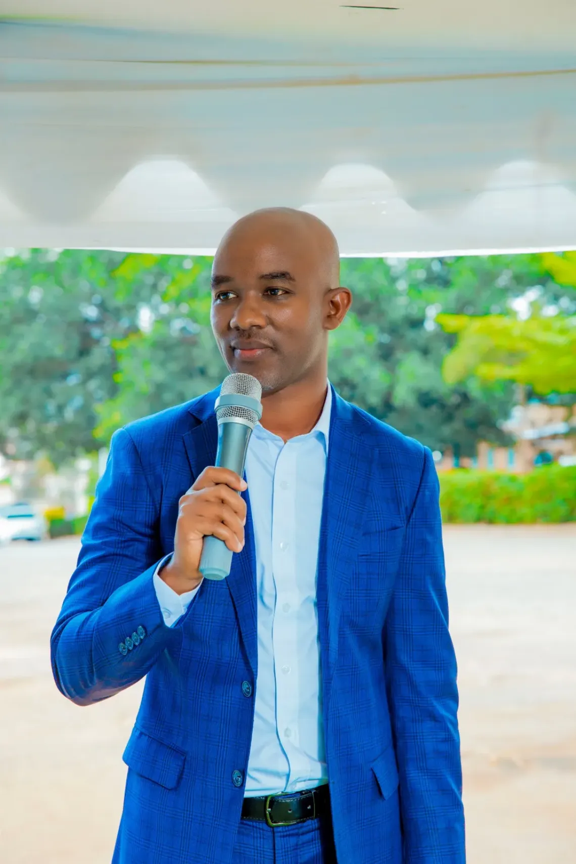 a leader speaking into a microphone