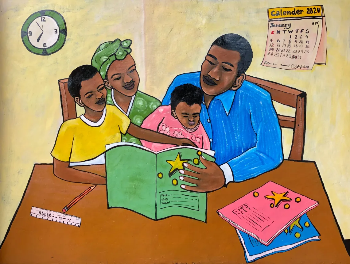 One of the completed murals at the Bigogwe Early Childhood Devleopment Centre in Nyabihu District. The painting encourages parents to promote learning at home by reading together with their children. 
